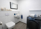 Gäste WC im Erdgeschoß mit Wäschetrockner
